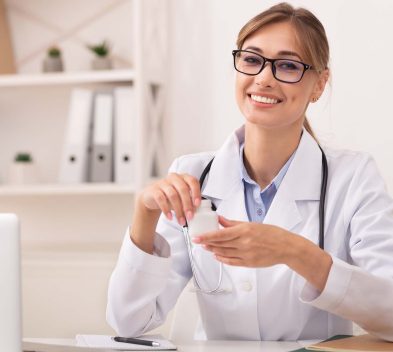 smiling-doctor-woman-holding-prescribed-medication-2022-12-16-08-49-38-utc.jpg